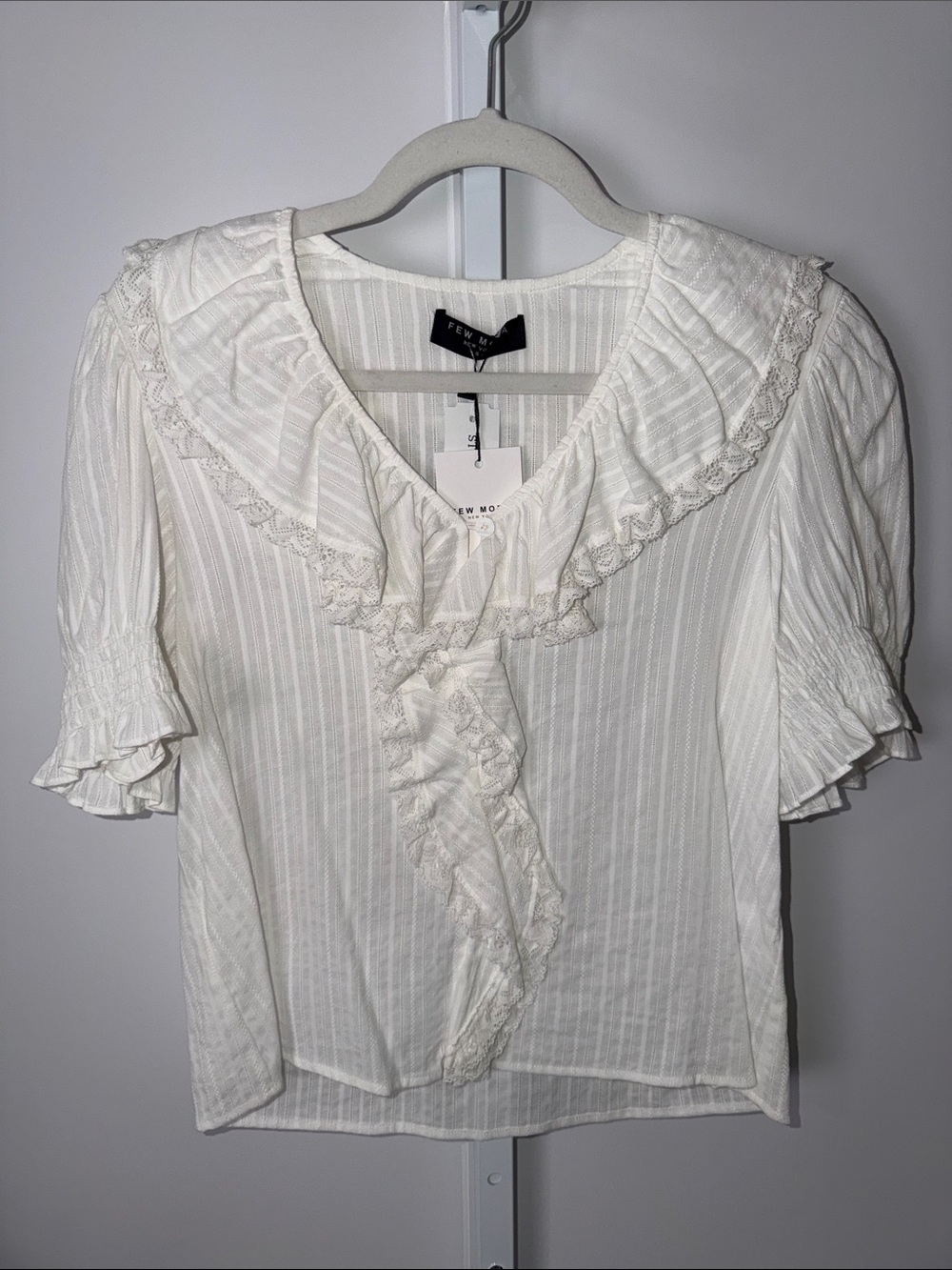 White Ruffled V-Neck Blouse with Lace Trim